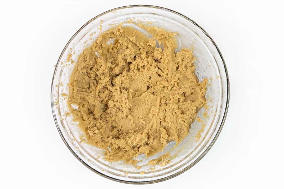Softened butter, light brown sugar, and granulated sugar are mixed in a bowl.