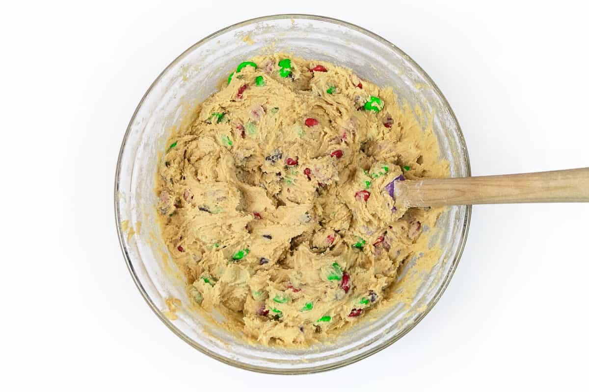 The M&M's and mini chocolate chips are mixed with the cookie dough.