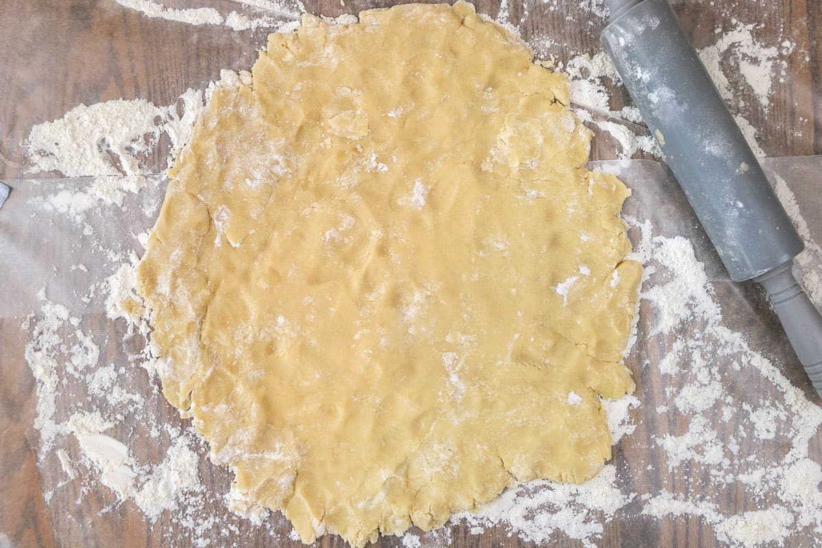 The dough is rolled out with a rolling pin.