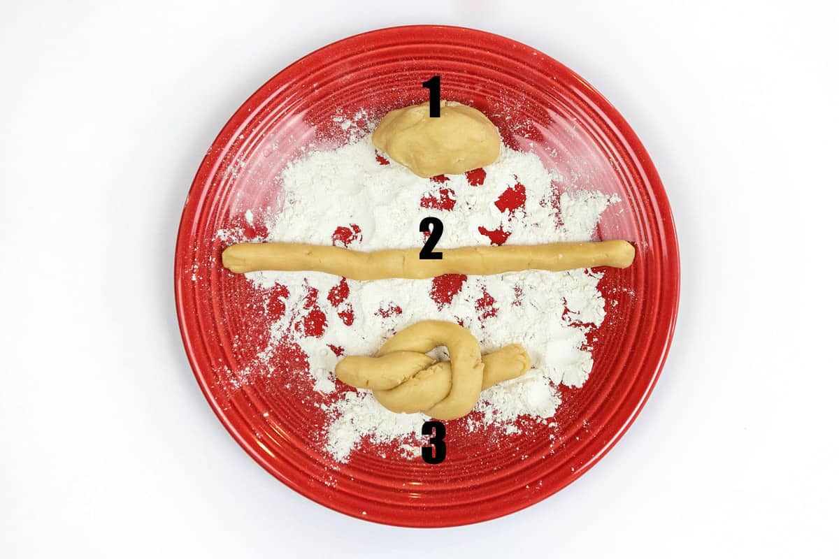 The dough strips are tied into knots.