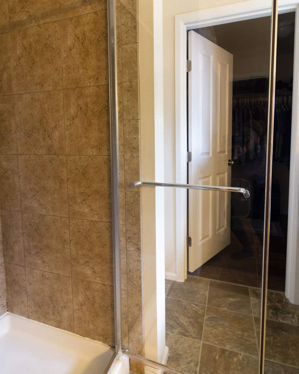 Clean shower door after using vinegar cleaner.