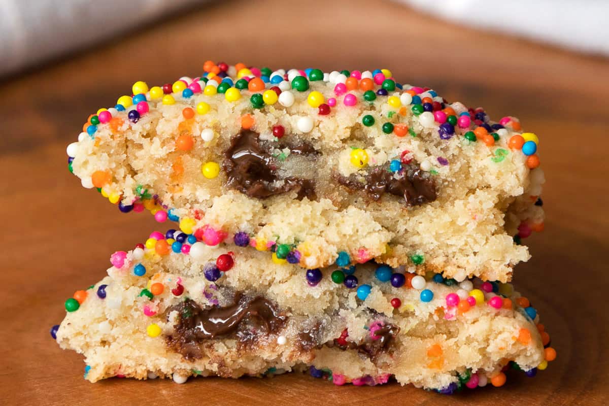 Cream cheese cookie with sprinkles cut in half.