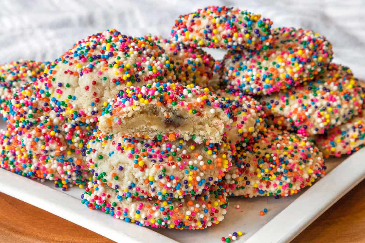 Cream cheese sprinkle cookies on a plate.