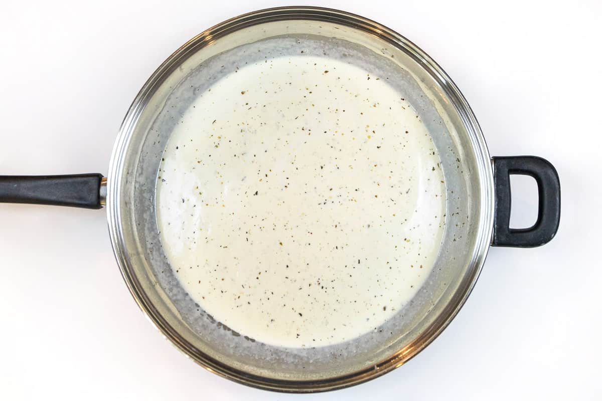 Cook the heavy whipping cream mixture until it starts to thicken.