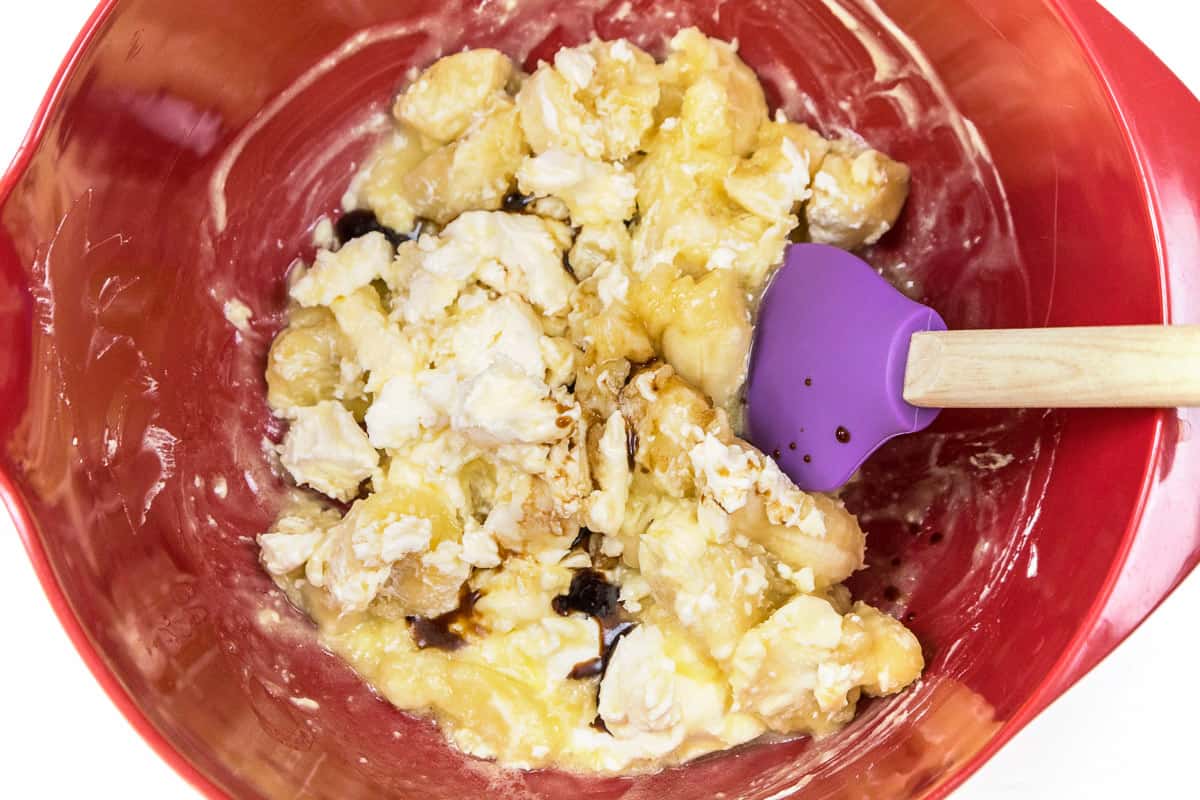 The cream cheese and vanilla extract are added to the banana mixture.