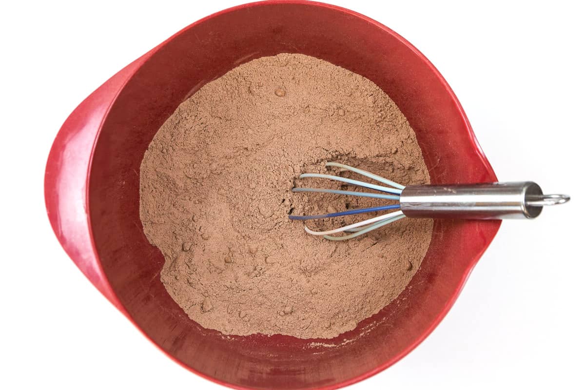 The flour, brown sugar, cocoa powder, baking soda, baking powder, and salt are stirred together.
