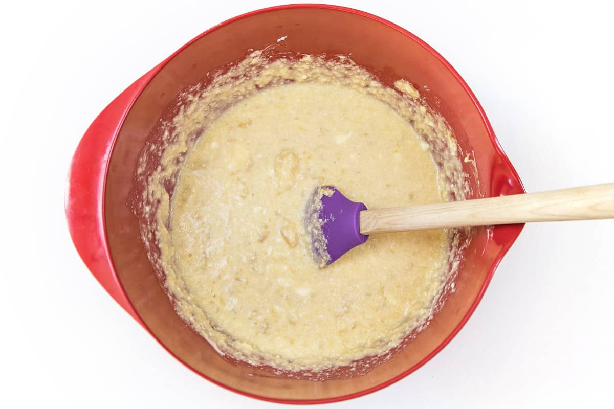 The banana bread batter is in a bowl.