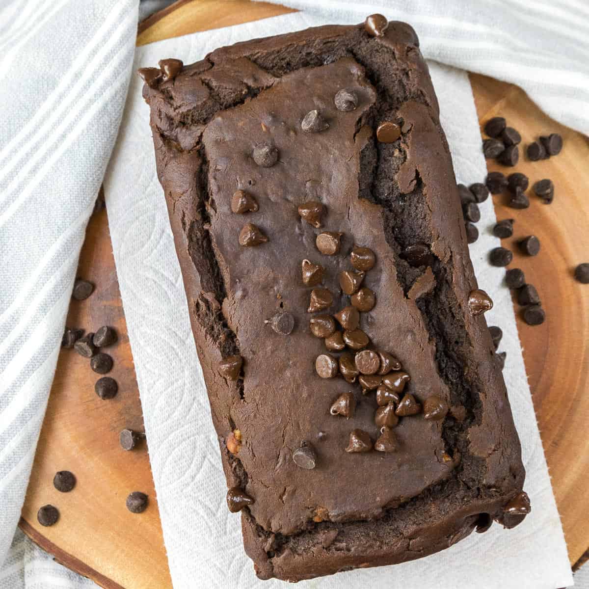 A loaf of double chocolate banana bread with chocolate chips.