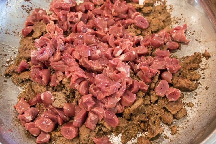 Add the chicken hearts to the liver.
