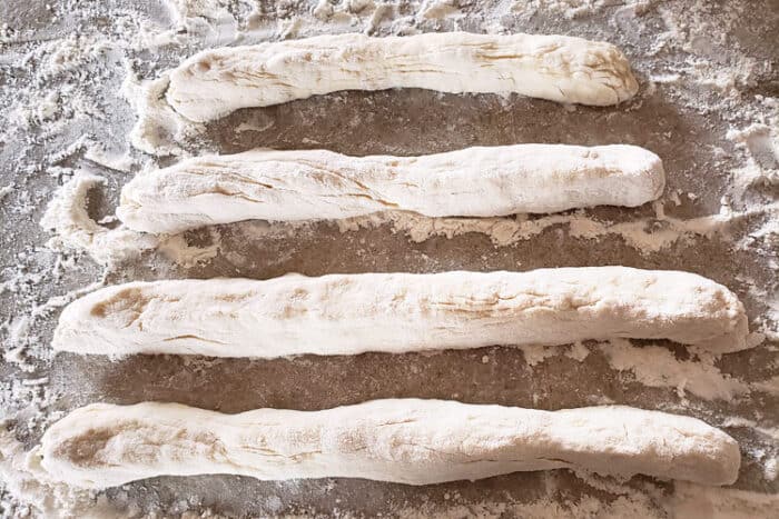 Roll the dough into long tube-like shapes.