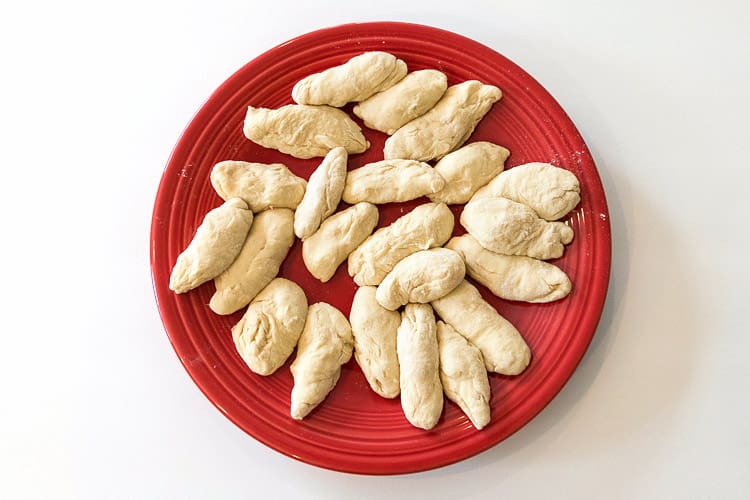 Dumpling dough formed into noodle shapes.