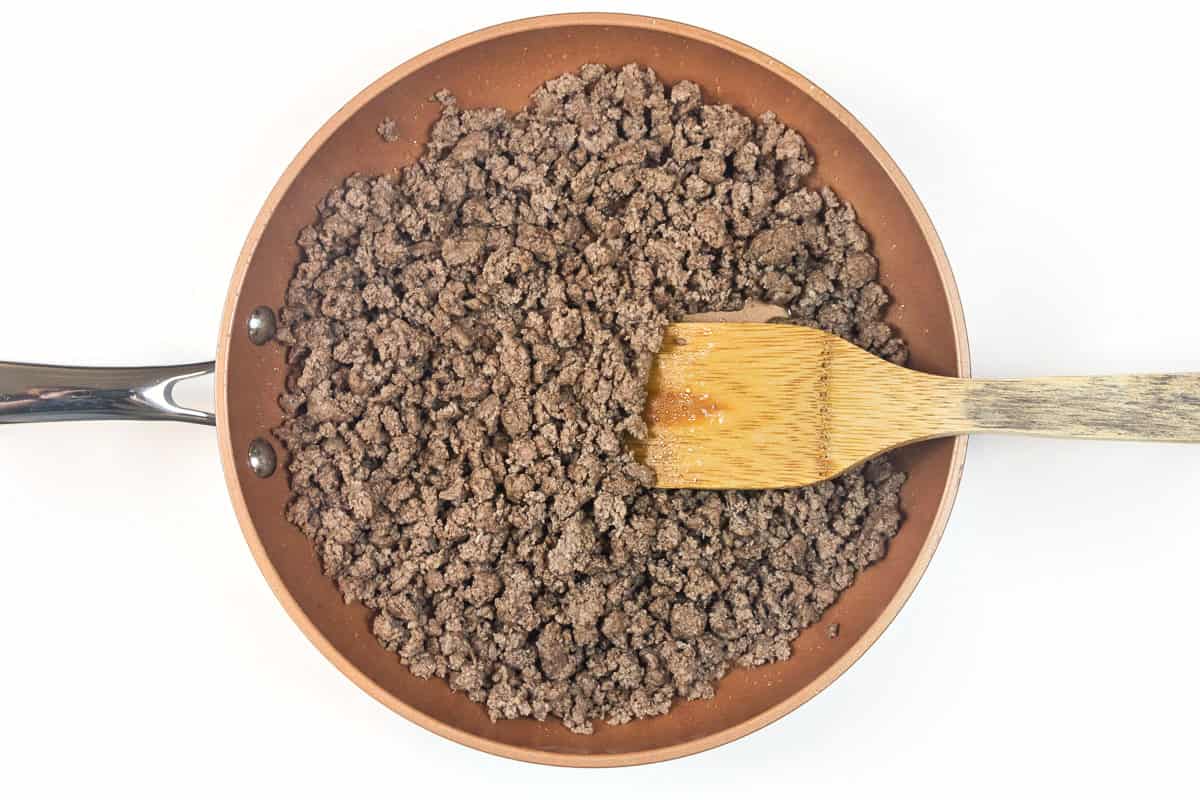 Brown one pound of ground beef for easy ground beef enchiladas recipe.