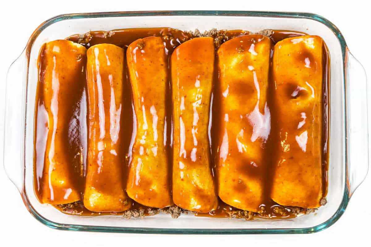 Pour enchilada sauce over the top of the six tortillas.