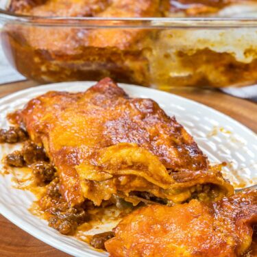 Ground beef enchiladas recipe close up on a plate.