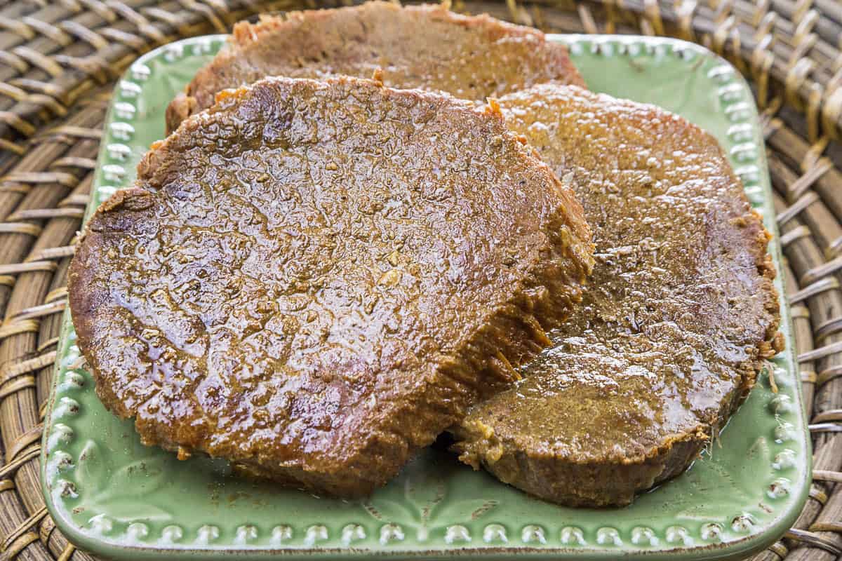Eye of round steak on a plate.