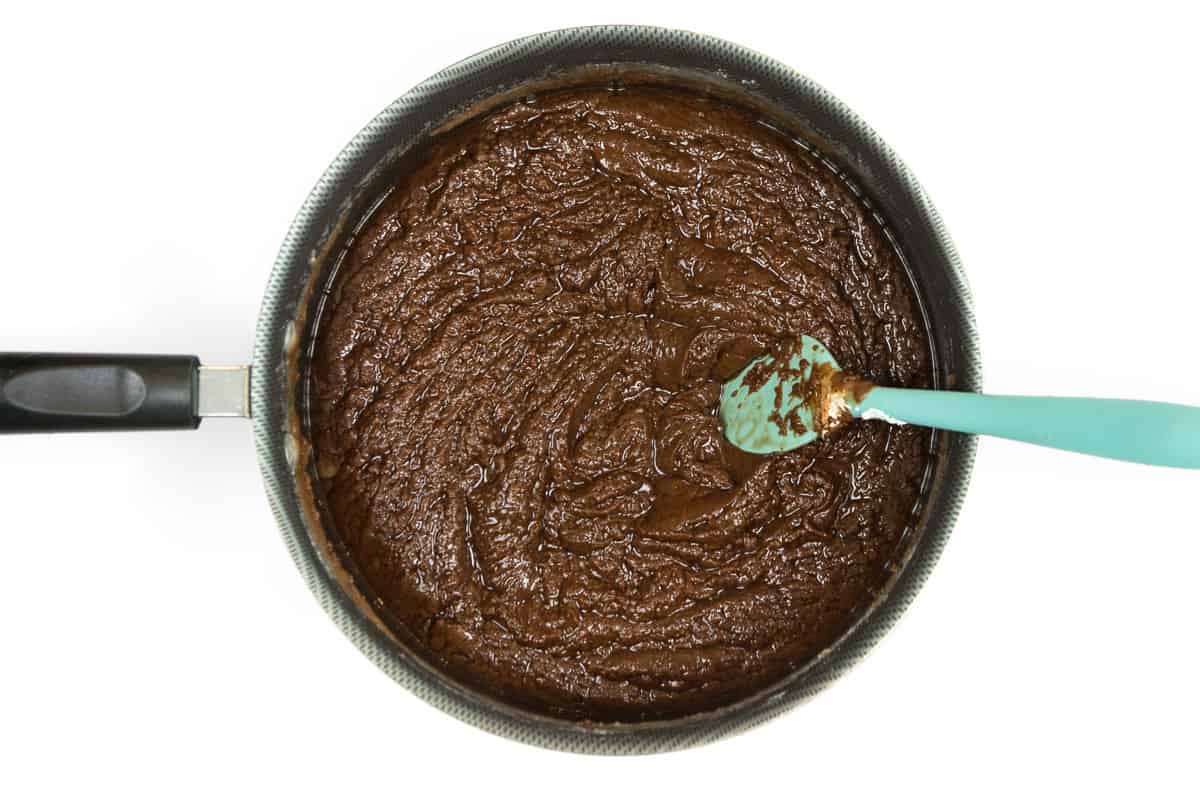 The semi-sweet chocolate chips, butter, sugar, and evaporated milk are combined.