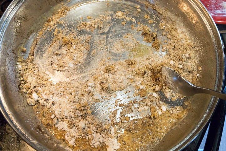 About one-fourth cup of drippings from pork chops and leftover flour is added to make a paste.