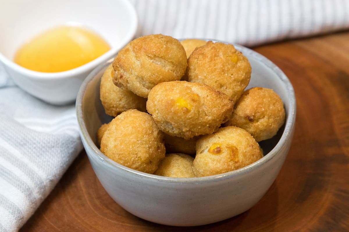 Crispy hush puppies in a bowl.
