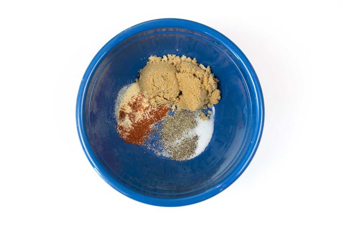 The seasonings are added to a bowl.