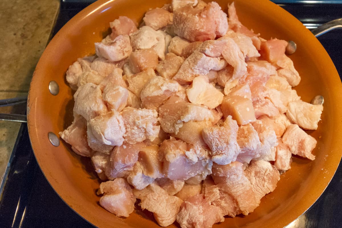 Chicken breast in the frying pan.