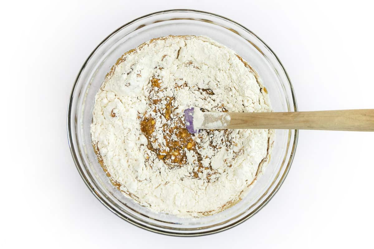 The flour mixture and molasses mixture are combined in a bowl.
