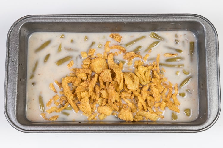 Fried onions are added to the loaf pan. Bake at three hundred and fifty degrees Fahrenheit for twenty-five minutes.