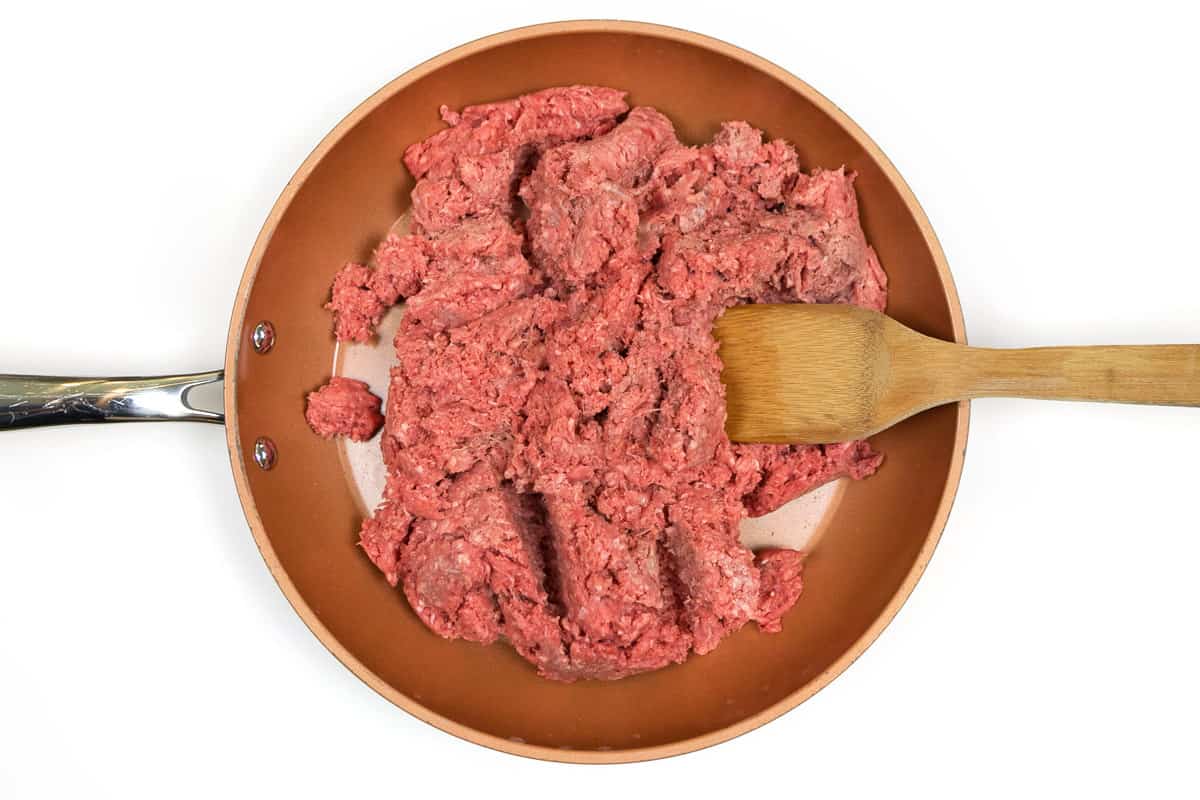 Lean ground beef in a frying pan.