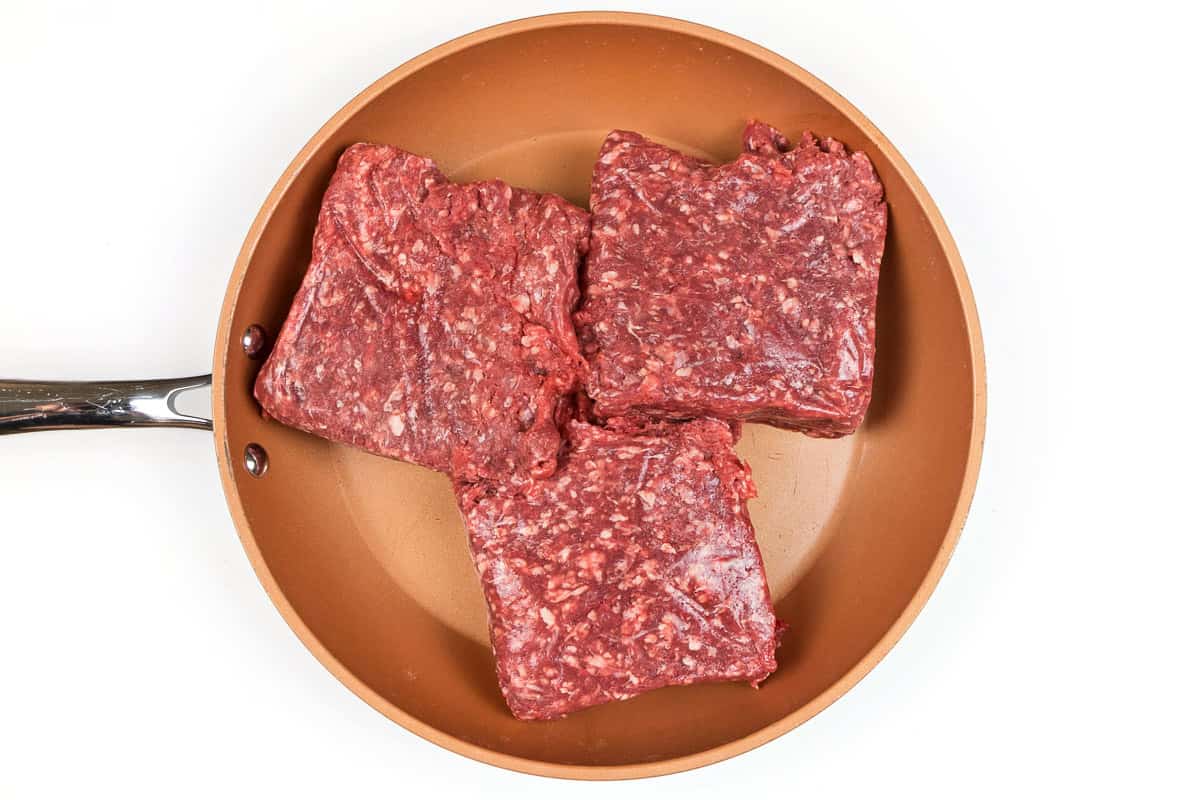 Ground beef in a frying pan.