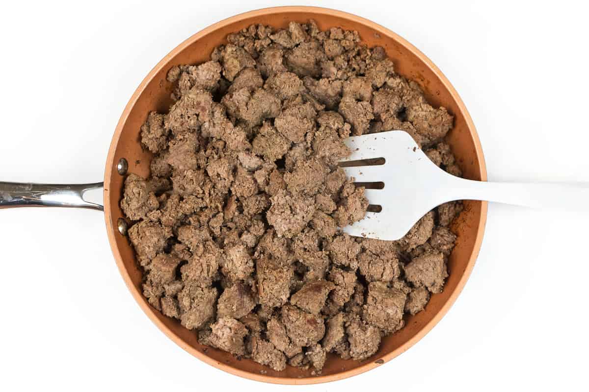Frying the ground beef in large chunks for the hamburger soup with cabbage and potatoes.