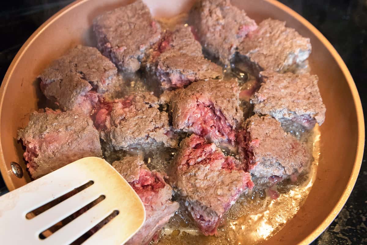 Frying the ground beef in large chunks for the hamburger soup.