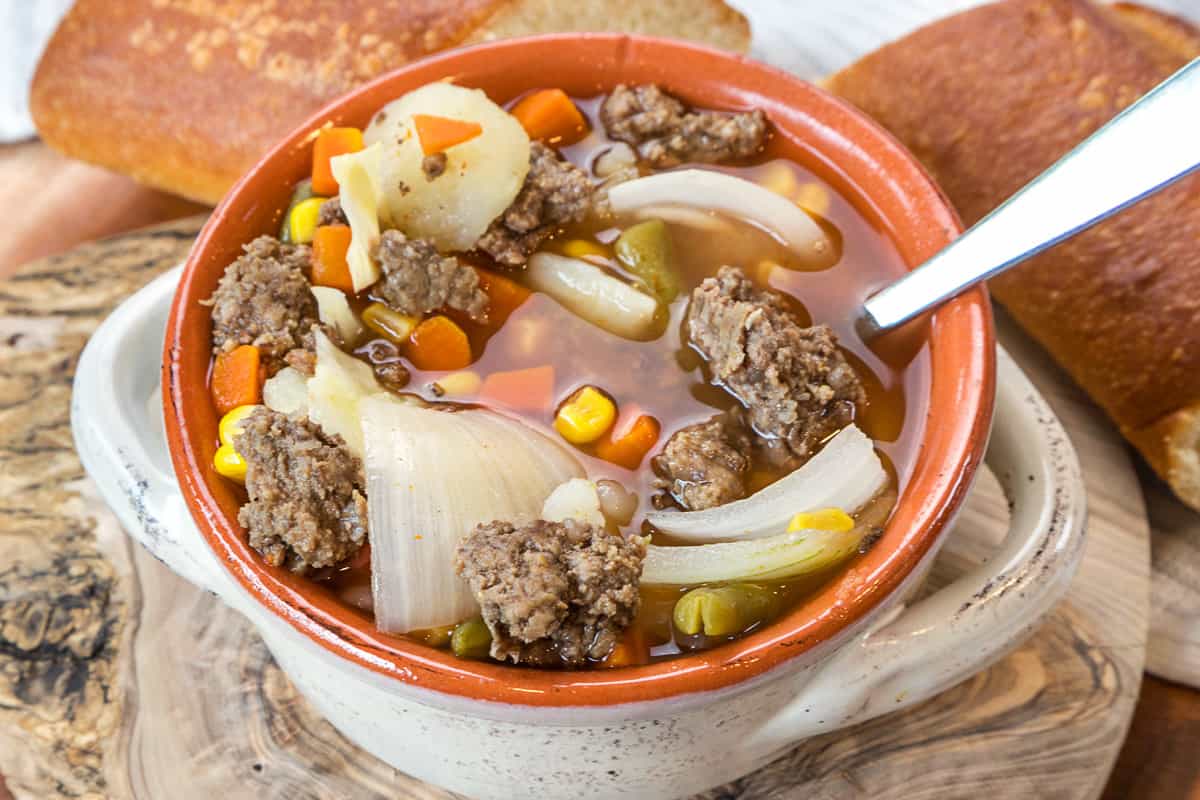 Hamburger soup with cabbage and potatoes in a bowl.