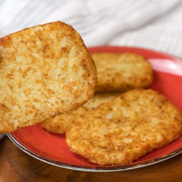 Close up of frozen hash browns cooked in the air fryer recipe.