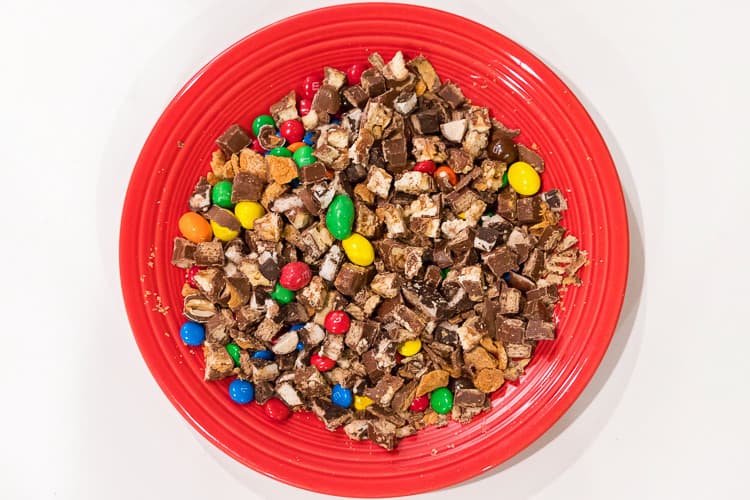 Cut up Halloween candy on a plate.