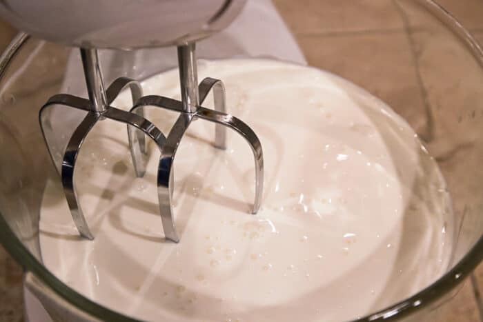 Whipping cream in a mixing bowl.