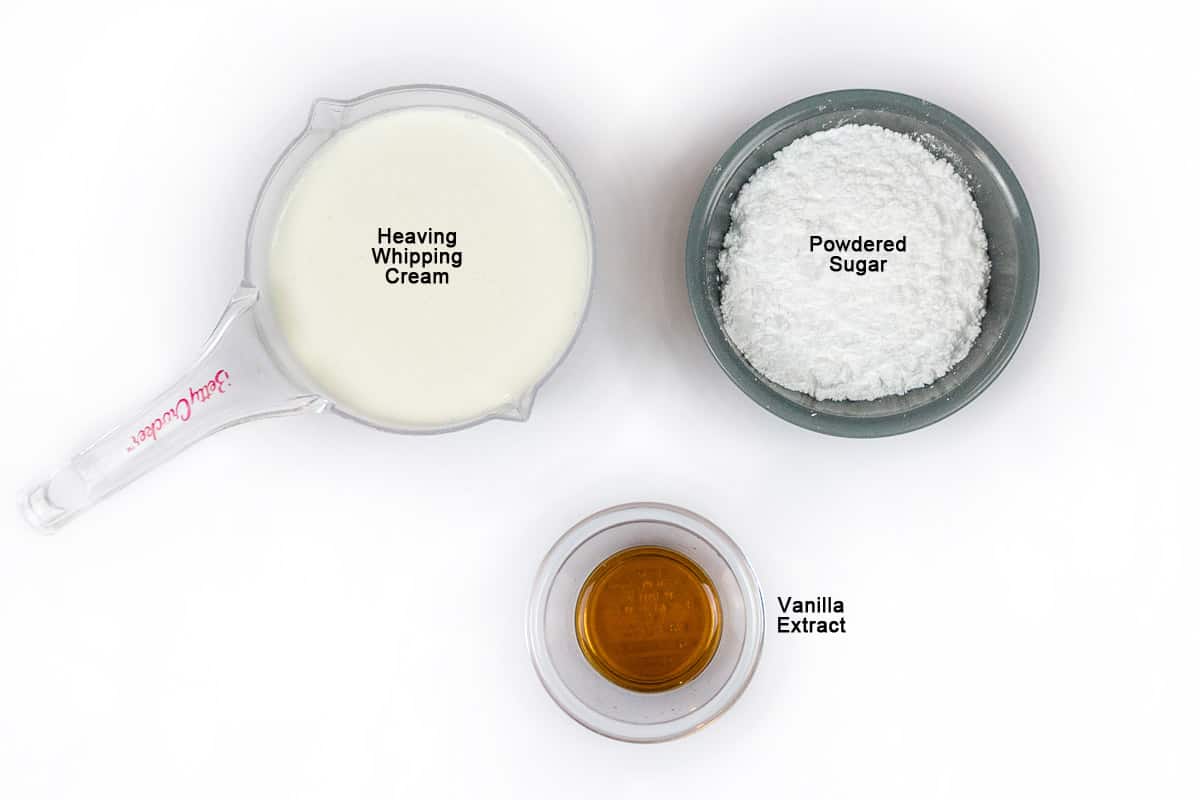 Ingredients for homemade whipped cream - two cups of heavy whipping cream, one teaspoon of vanilla extract, and one-half cup of powdered sugar.