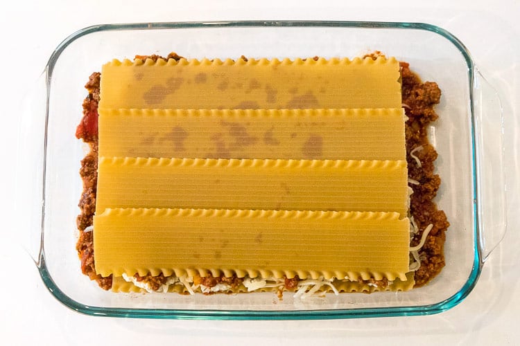 Another layer of lasagna noodles over the top of the ground beef mixture.