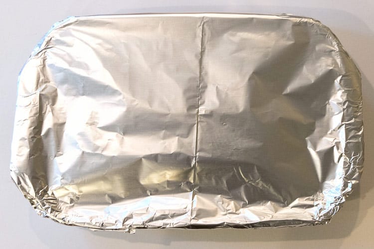 Cover with aluminum foil, then bake the homemade ricotta cheese lasagna at three hundred and fifty degrees Fahrenheit for thirty minutes.