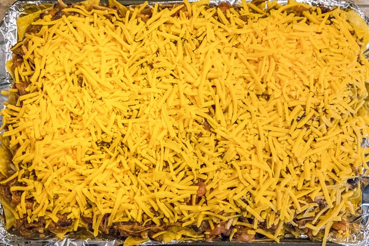 Spread cheddar cheese over the pulled pork and salsa mixture.