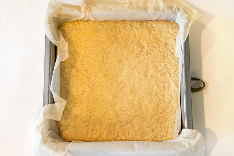Lemon bars crust is done baking in the oven.