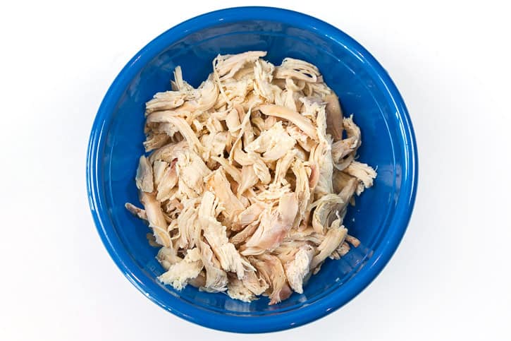 Shredded rotisserie chicken in a bowl.