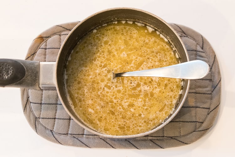 Butter, whole milk, salt and pepper in a pot.