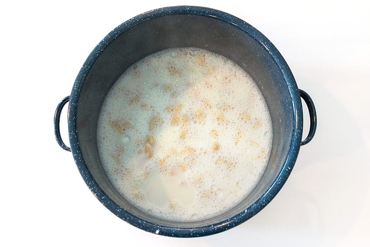 Milk soup with dumplings is done cooking on the stove.