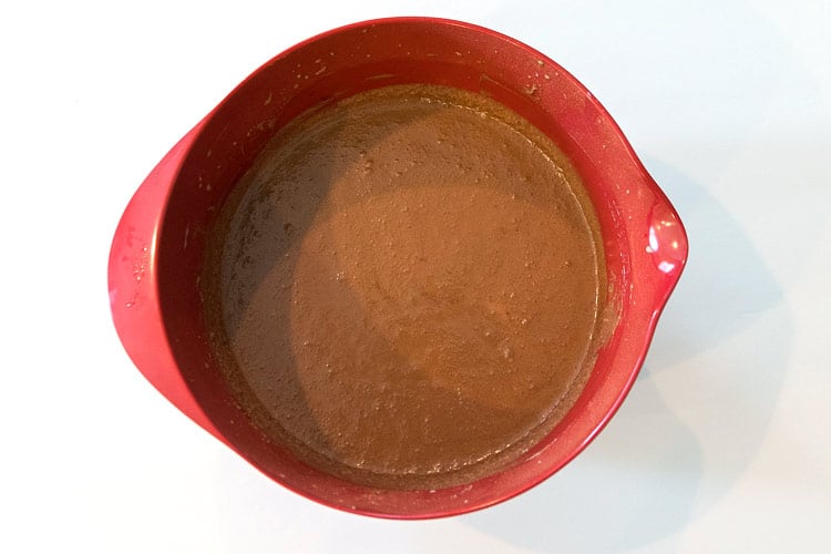 One and one-fourth cups of whole milk
and the melted chocolate chips are added to the brown sugar and butter mixture.