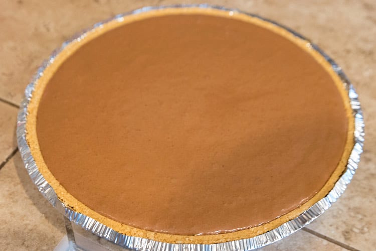 The mud pie filling is added to graham cracker crust.