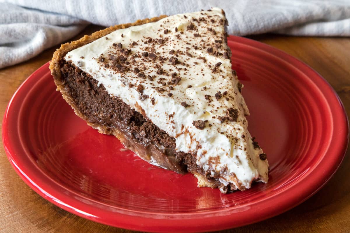 A slice of ultimate Mississippi mud pie on a plate.