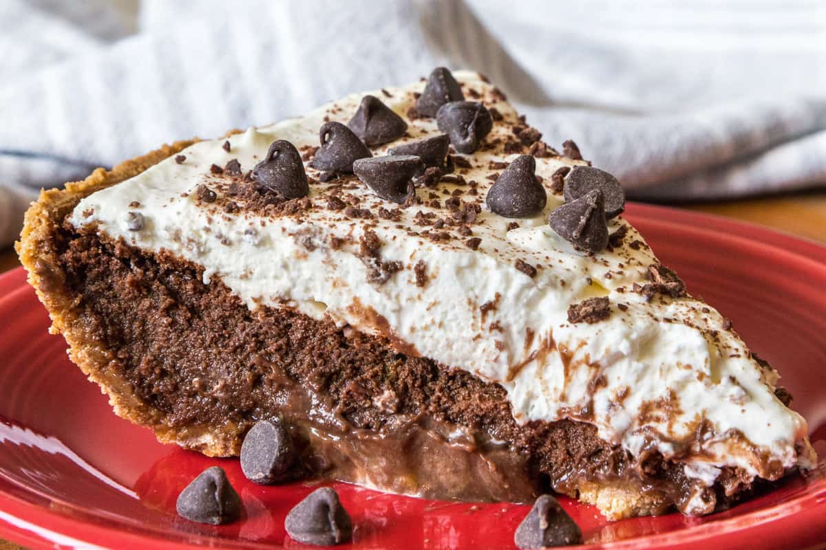 A slice of ultimate Mississippi mud pie on a plate.
