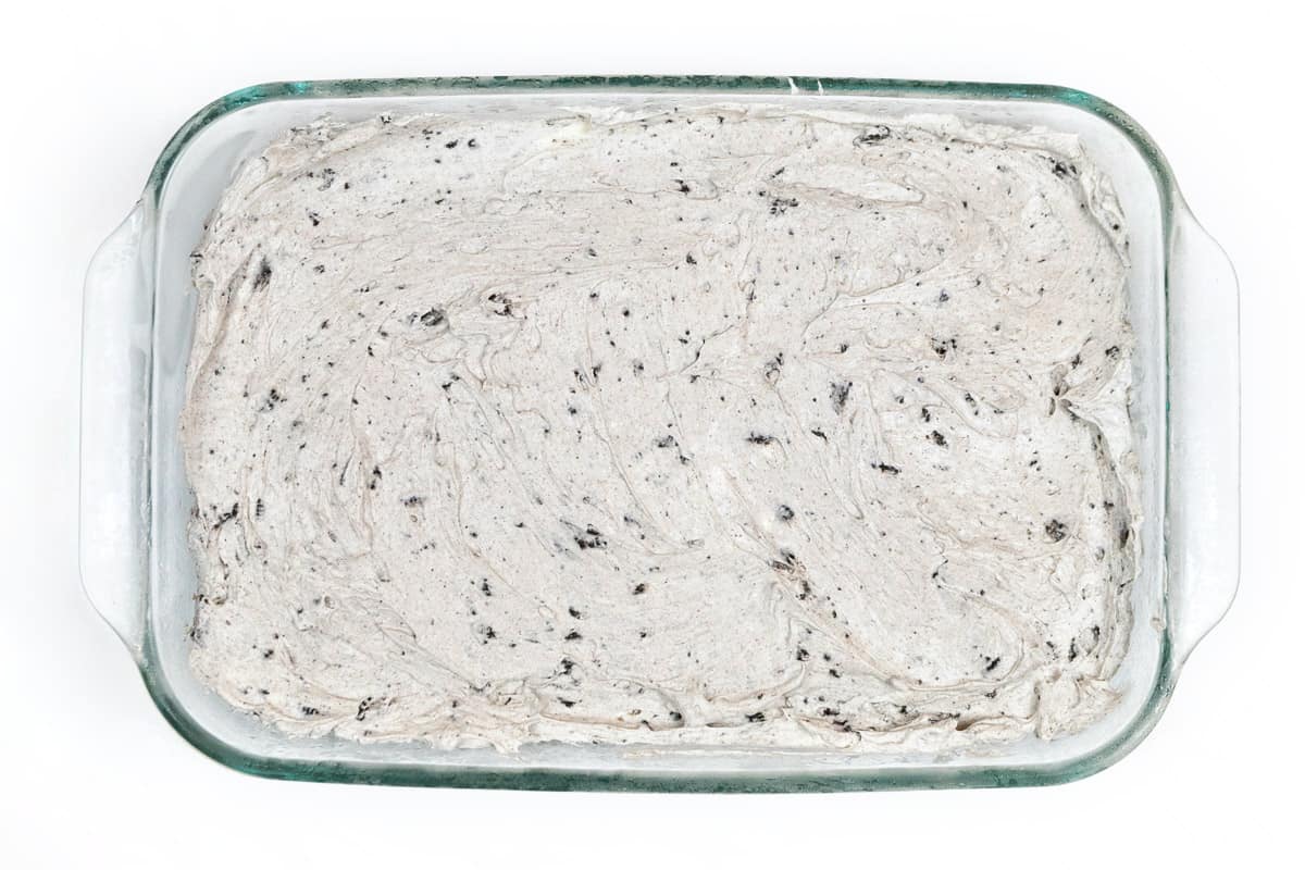 Spread the cream cheese mixture on top of the Oreo crust.