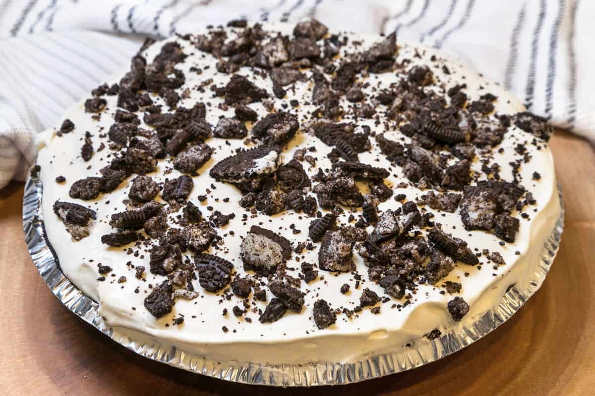 Oreo cheesecake with crushed Oreos on top.
