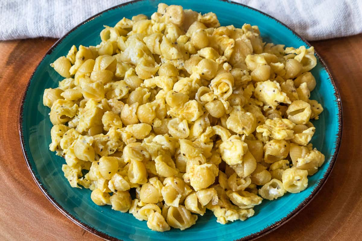 Noodles with scrambled eggs on a plate.