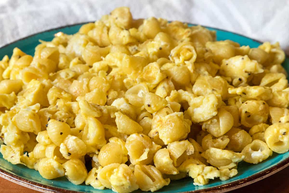 Noodles with scrambled eggs close up on a plate.